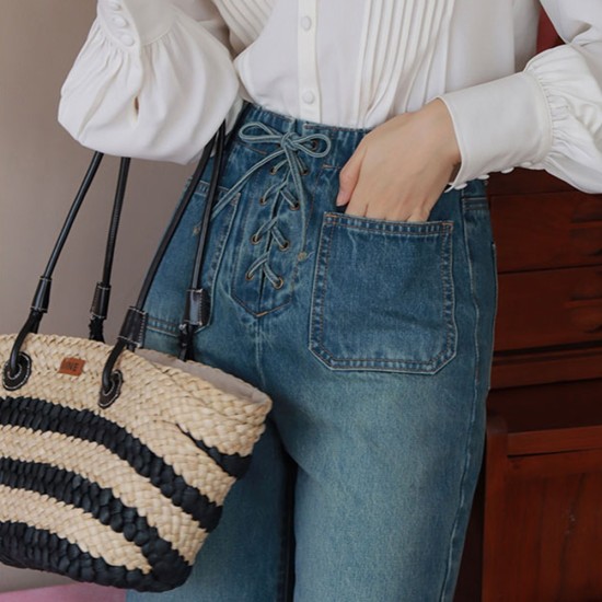 Handmade straw bag on one shoulder