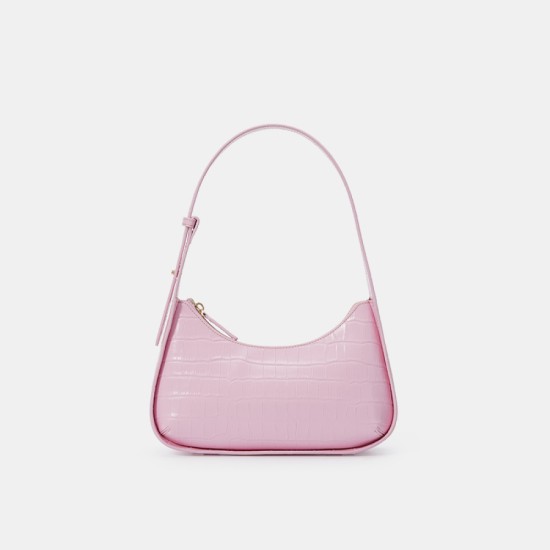 A pink silver bag with a design on one shoulder