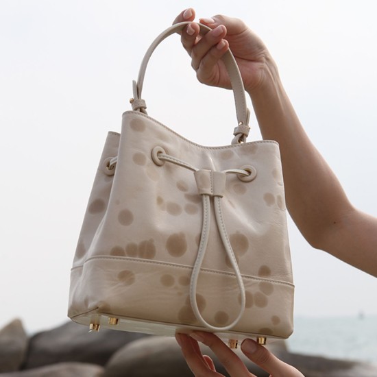 Drawstring bucket bag for female designer, top layer cowhide commuting hand-held shoulder bag