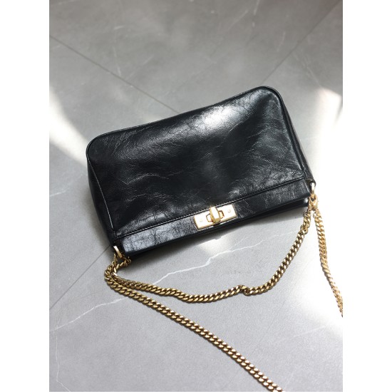 Women's commuter chain bag is worn crossbody over one shoulder