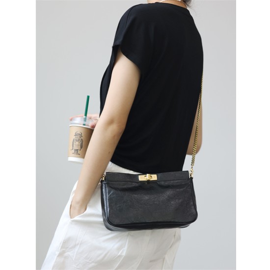 Women's commuter chain bag is worn crossbody over one shoulder