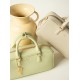 Leather tote bag worn crossbody over one shoulder - Memoo.com